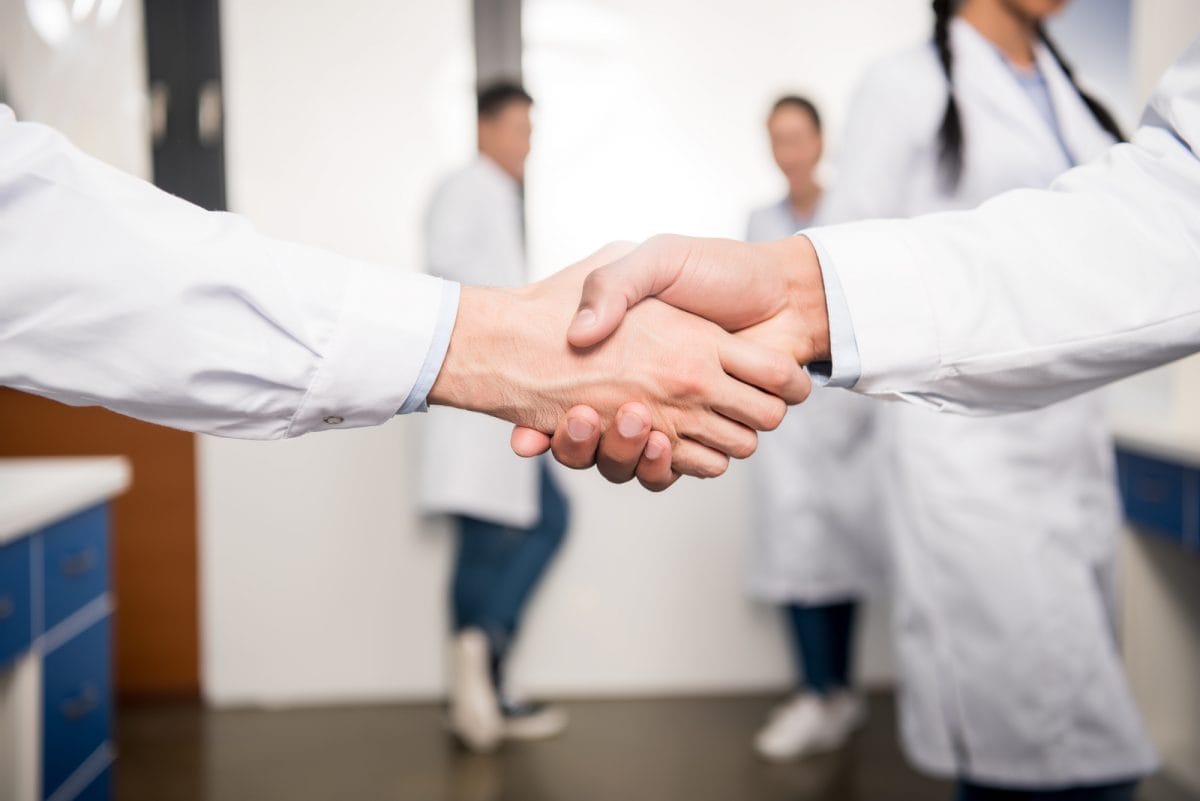 photo of doctors shaking hands