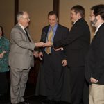 Above and below: Dr. Gerald Beathard (left) presents the Excellence in Outreach, Empowerment and Advocacy Award to Dr. Todd Broome, Jim Bevis, RT(R), Center Manager and Dr. Roger Coomer at the 2012 Lifeline Physician Operators Forum in Denver, CO.
